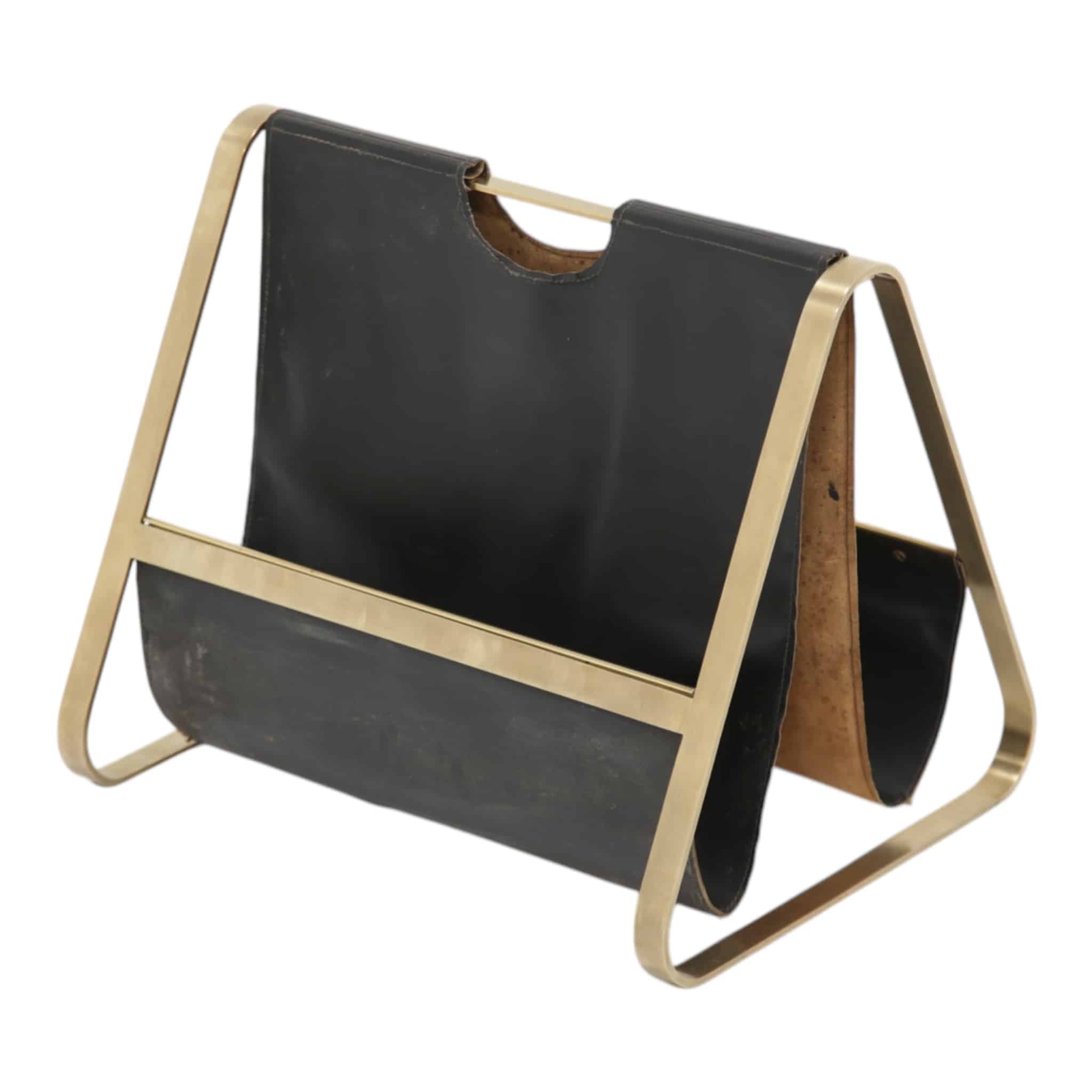 Brass and leather mid-century French magazine rack white background.