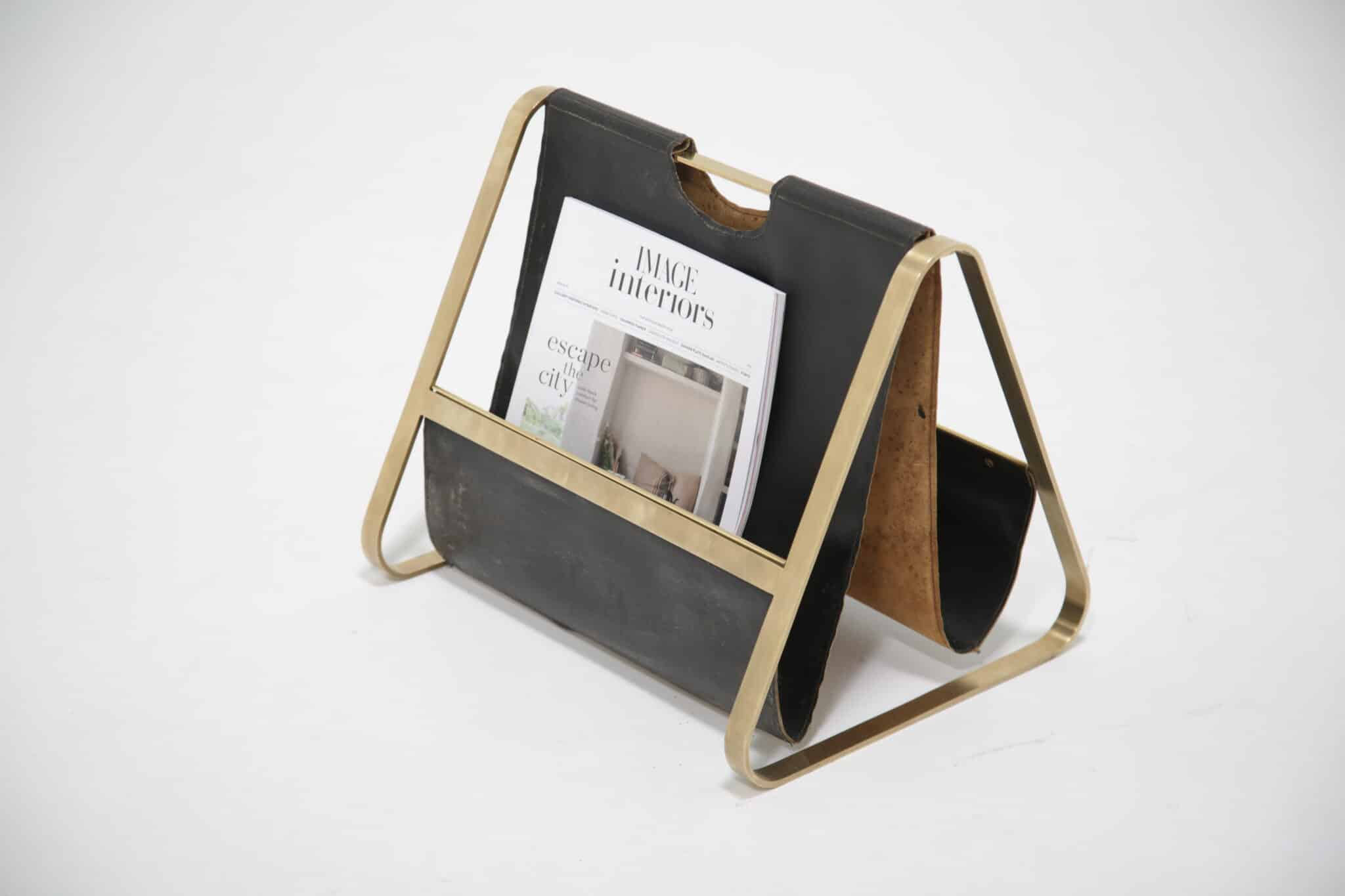 Brass and leather mid-century French magazine rack with magazine for scale.