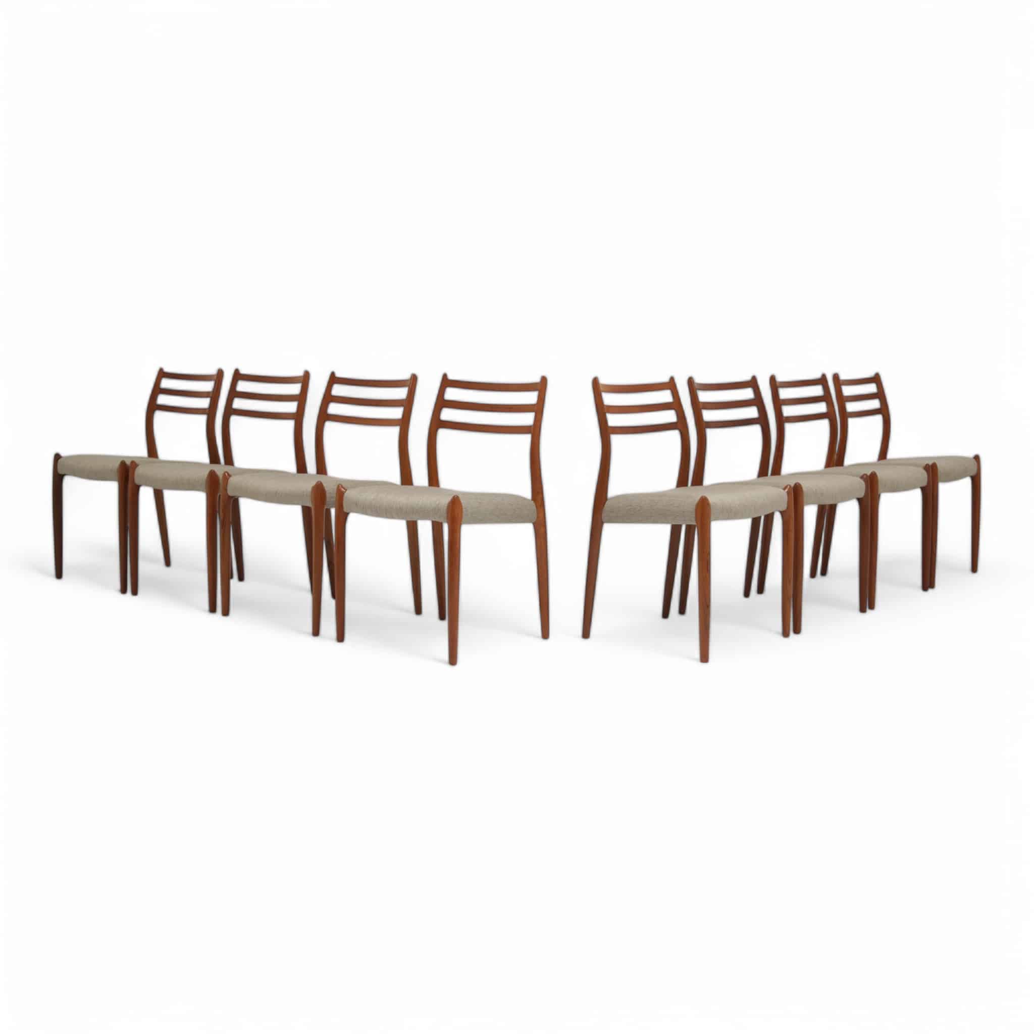 Vintage set of 8 Teak Dining Chairs Model 78 by Niels Otto Moller white background.