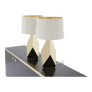 Pair of faceted brass American mid-century lamps on black sideboard